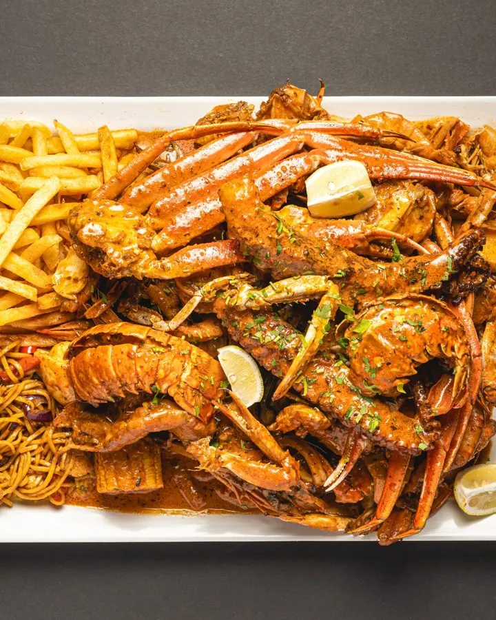 The Give Me Everything Boil: lobster tail, king shrimp, snow crab and swimmer crab in signature boil sauce